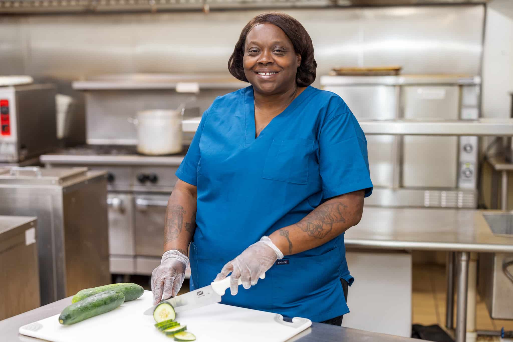 Chef cutting cucumber at Linley Park kitchen